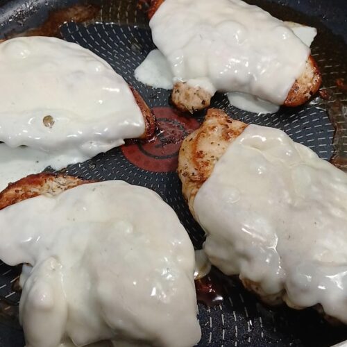 melted mozzarella cheese on chicken