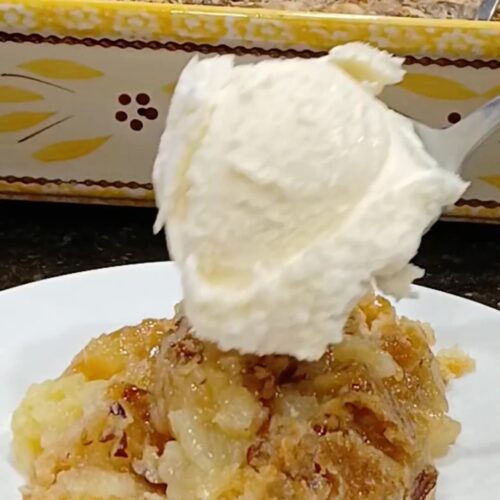 Pineapple Cobbler Dump Cake on a white plate