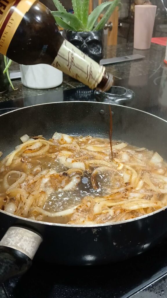 add chicken broth and worcestershire sauce to onions